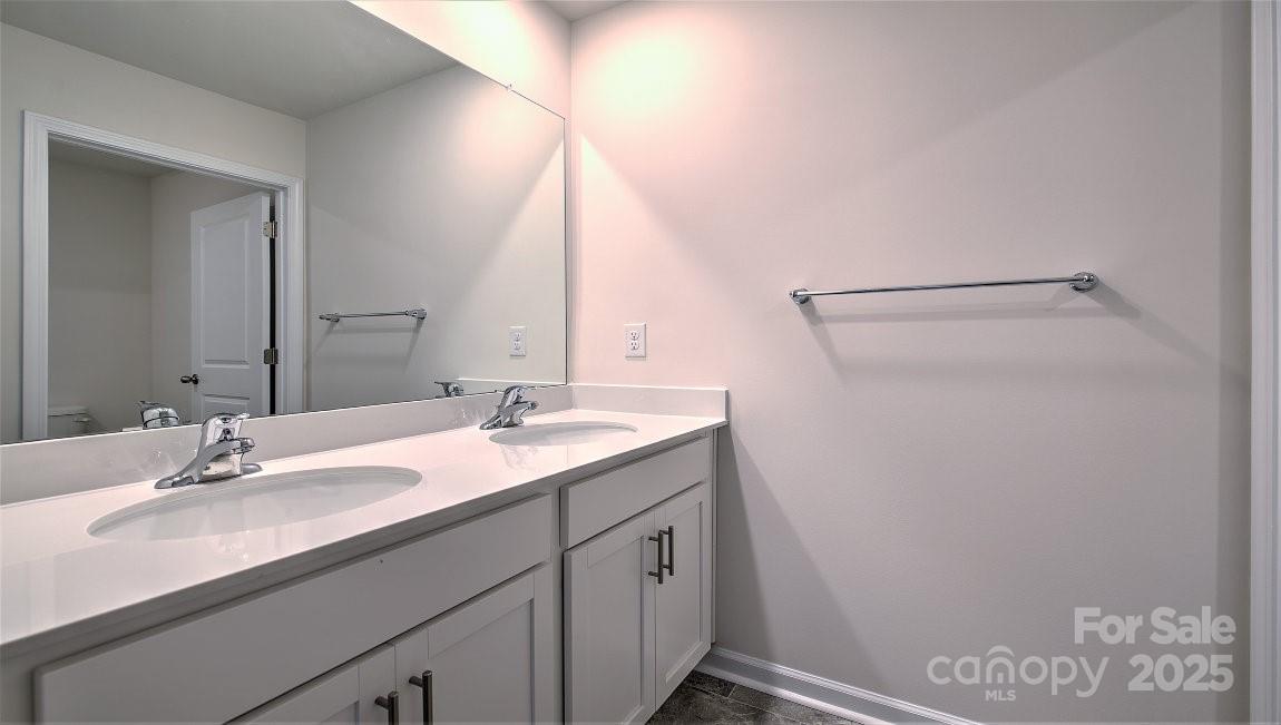 180 Salers Road Fletcher, NC 28732 - Photo 14 of 29 a bathroom with a sink and a mirror