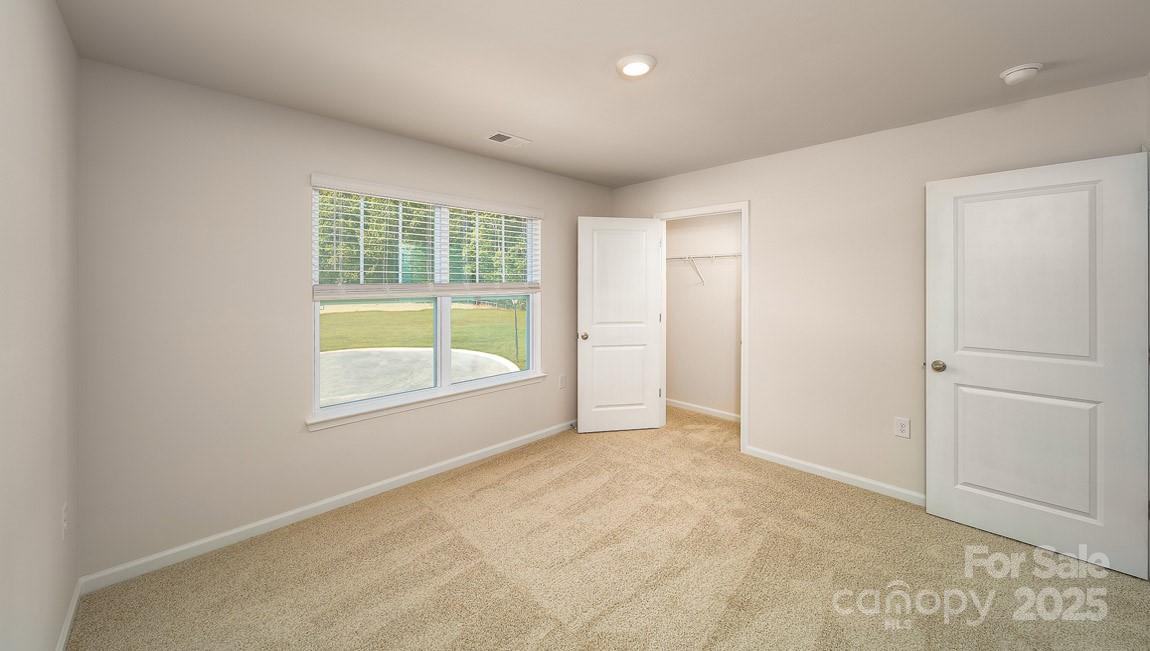 180 Salers Road Fletcher, NC 28732 - Photo 18 of 29 an empty room with a window