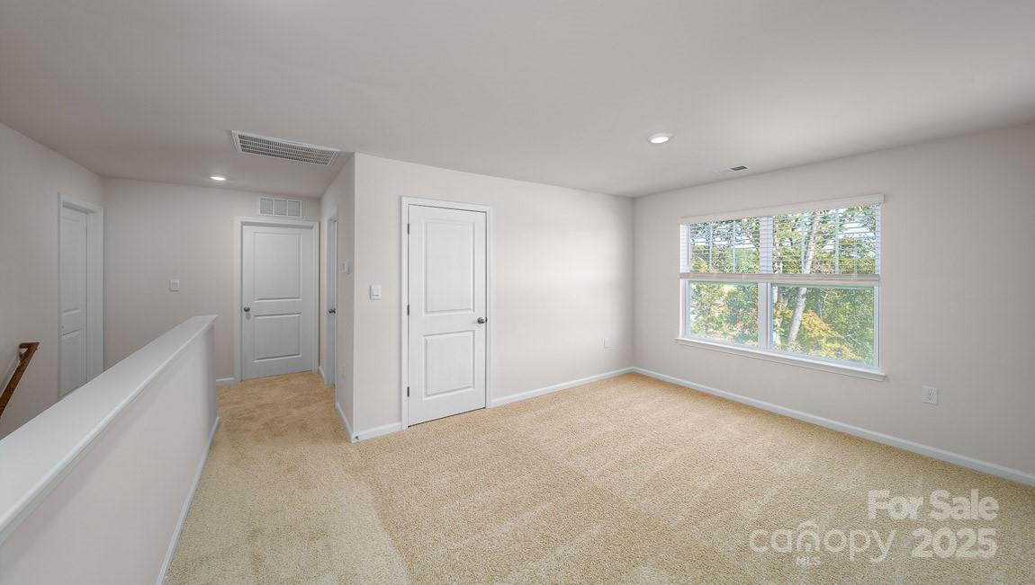 180 Salers Road Fletcher, NC 28732 - Photo 19 of 29 a view of an empty room with a window