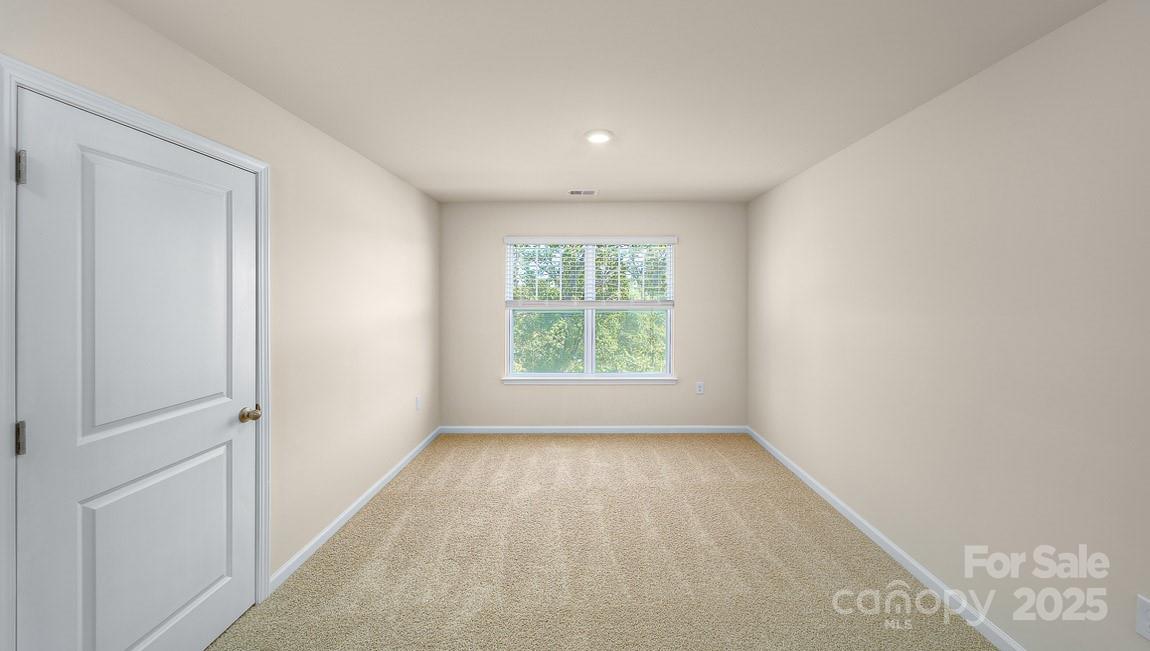 180 Salers Road Fletcher, NC 28732 - Photo 20 of 29 a view of an empty room with a window