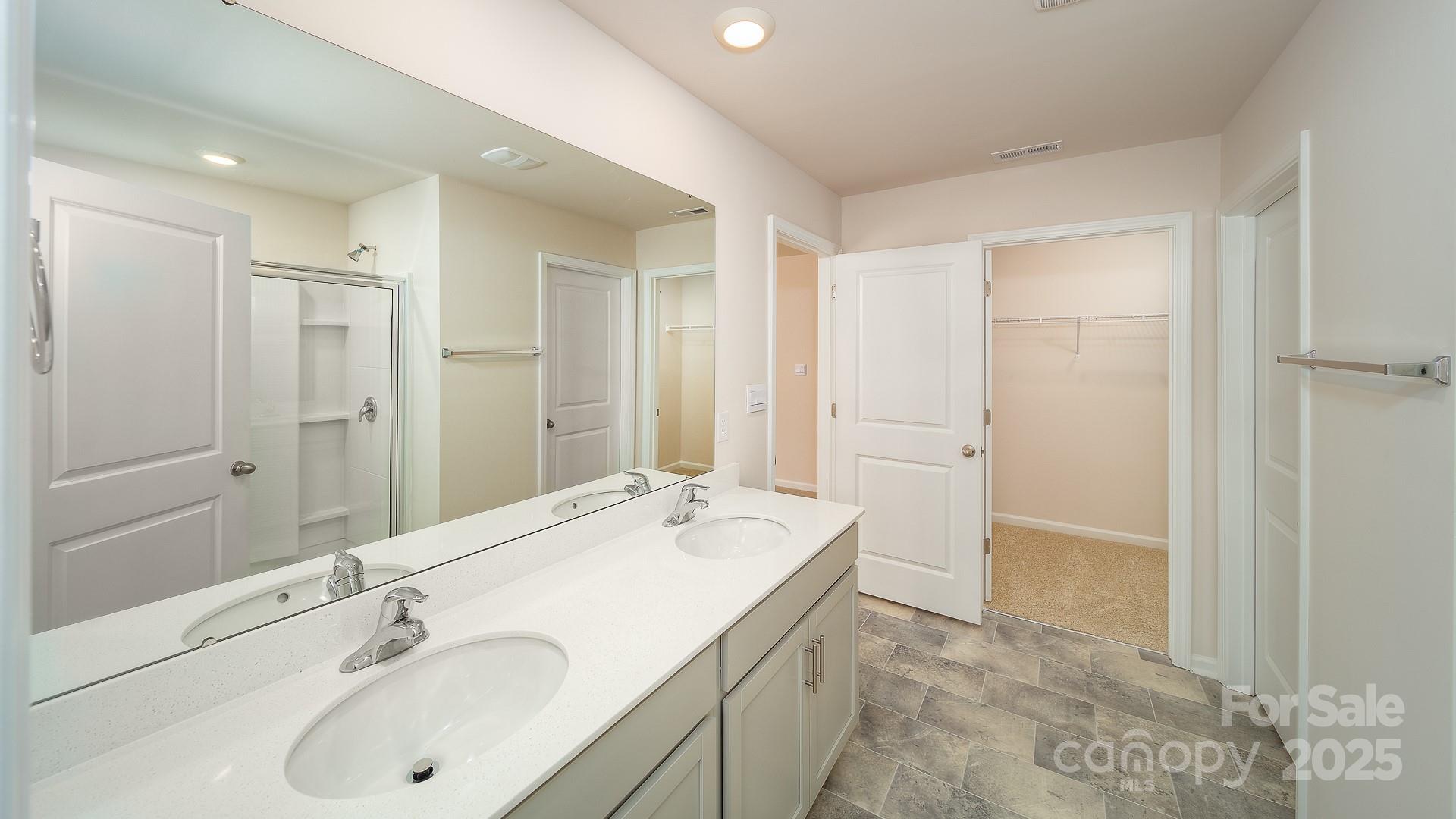 180 Salers Road Fletcher, NC 28732 - Photo 21 of 29 a bathroom with a tub sink and mirror