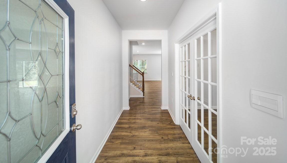 180 Salers Road Fletcher, NC 28732 - Photo 8 of 29 a view of a hallway with wooden floor and entryway