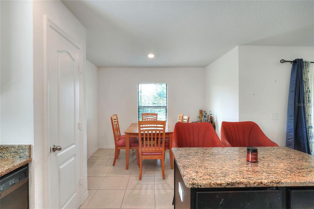 2166 Mandarin Loop Dundee, FL 33838 - Photo 15 of 44 a living room with furniture and a window