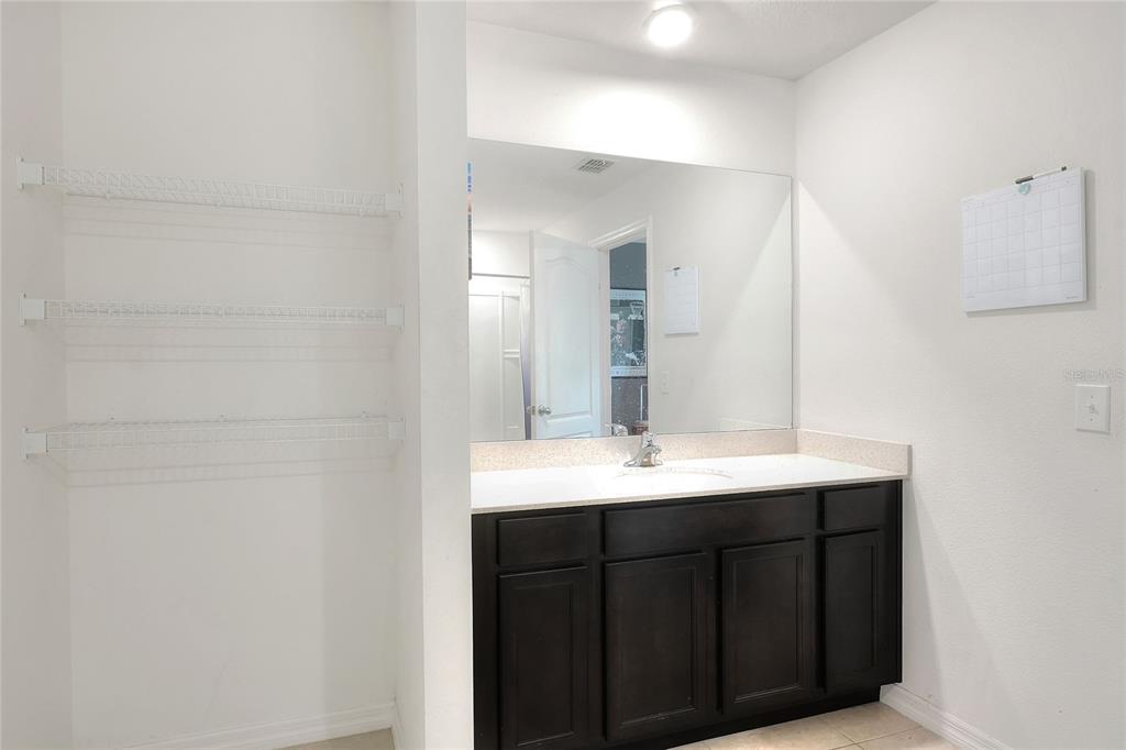 2166 Mandarin Loop Dundee, FL 33838 - Photo 21 of 44 a bathroom with a sink and a mirror