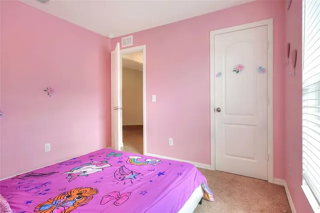 a white toilet sitting next to a shower