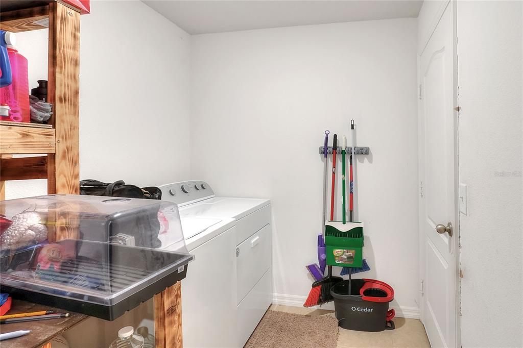 2166 Mandarin Loop Dundee, FL 33838 - Photo 30 of 44 a room with a sink and a stove top oven