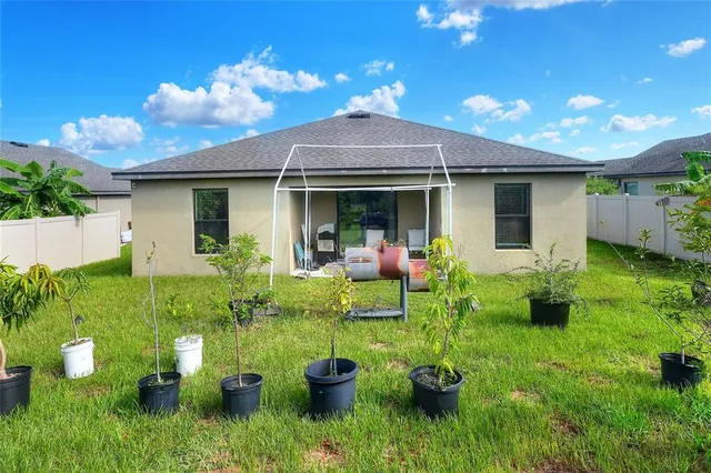 a garden with trees in the background