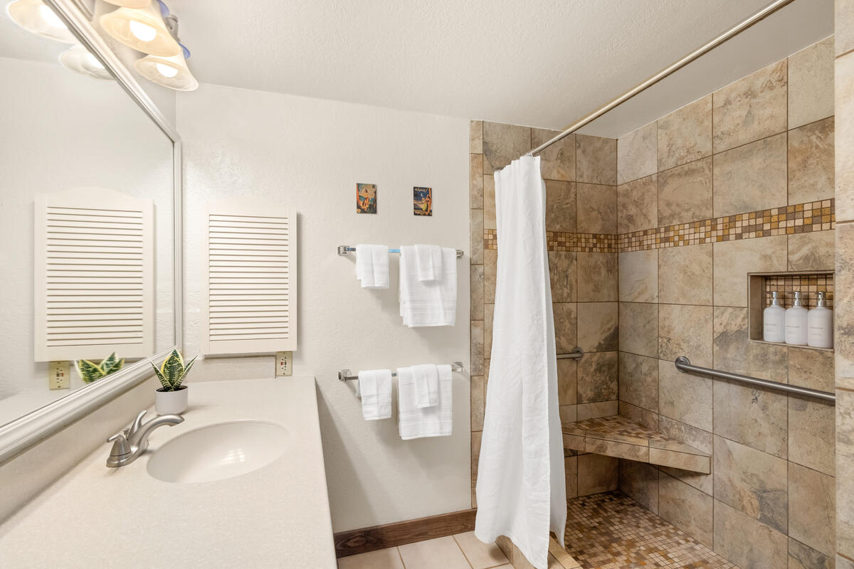 2721 Poipu Road, Unit 100 Koloa, HI 96756 - Photo 14 of 26 a bathroom with a sink and a shower