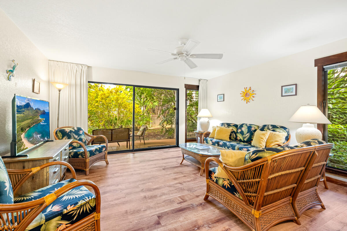 2721 Poipu Road, Unit 100 Koloa, HI 96756 - Photo 5 of 26 a living room with furniture and a large window