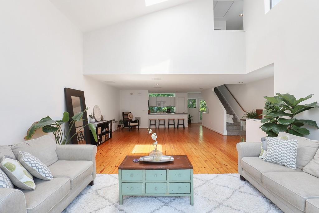 241 Maynard Terrace Southeast, Unit 30 Atlanta, GA 30316 - Photo 1 of 1 a living room with furniture and a potted plant