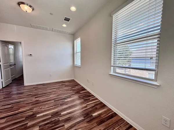 a view of an empty room and window