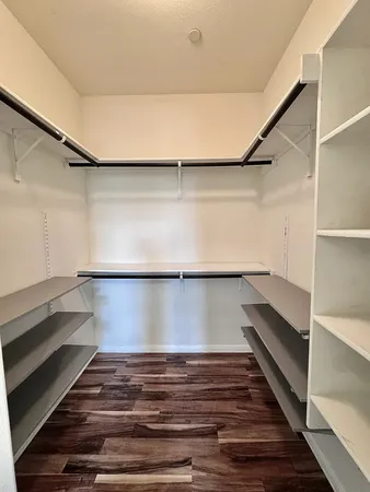 a bathroom with a double vanity sink a mirror and a shower