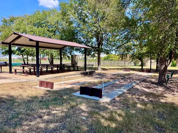 a view of a swimming pool with an outdoor seating