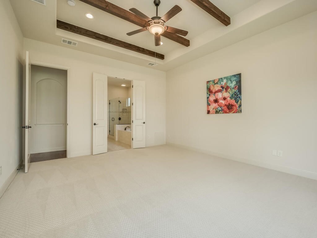 12912 Schleicher Trail Austin, TX 78732 - Photo 19 of 39 en empty room with fan and a ceiling fan