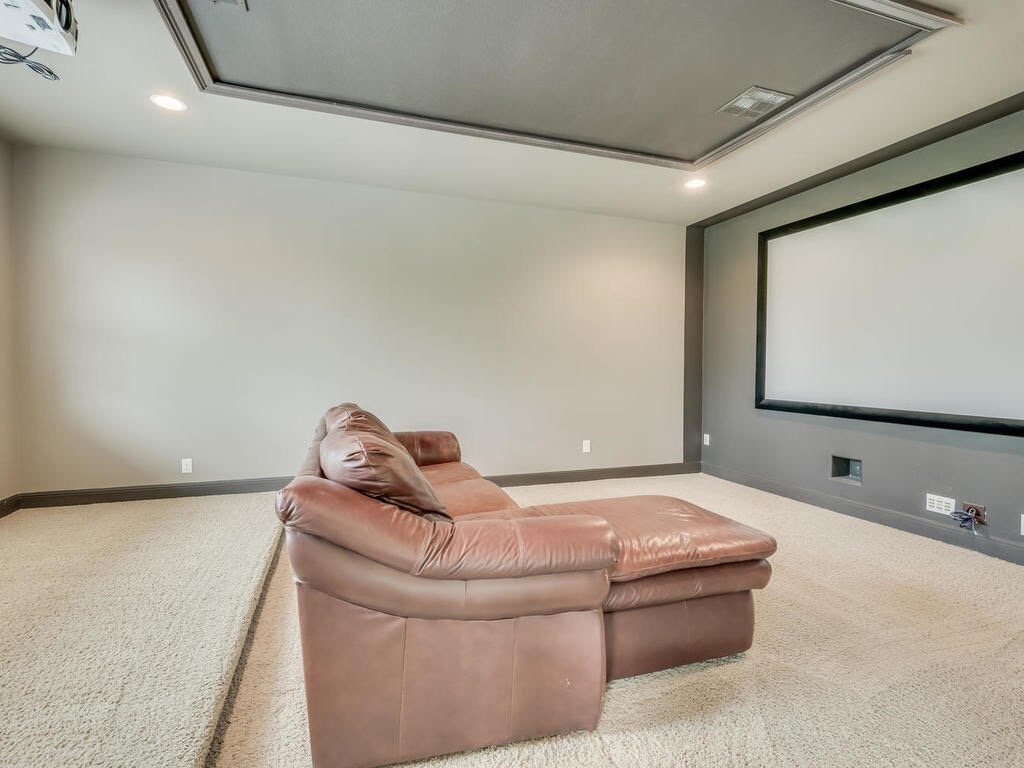 12912 Schleicher Trail Austin, TX 78732 - Photo 27 of 39 a living room with furniture and a flat screen tv