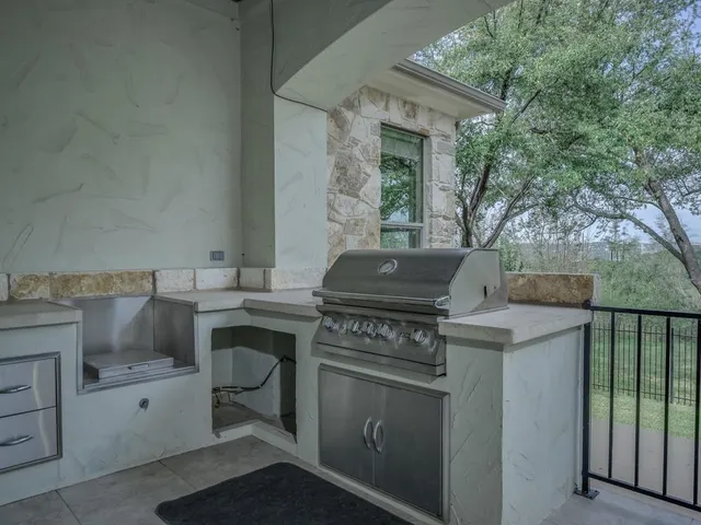 a bathroom with a granite countertop double vanity sink and a mirror