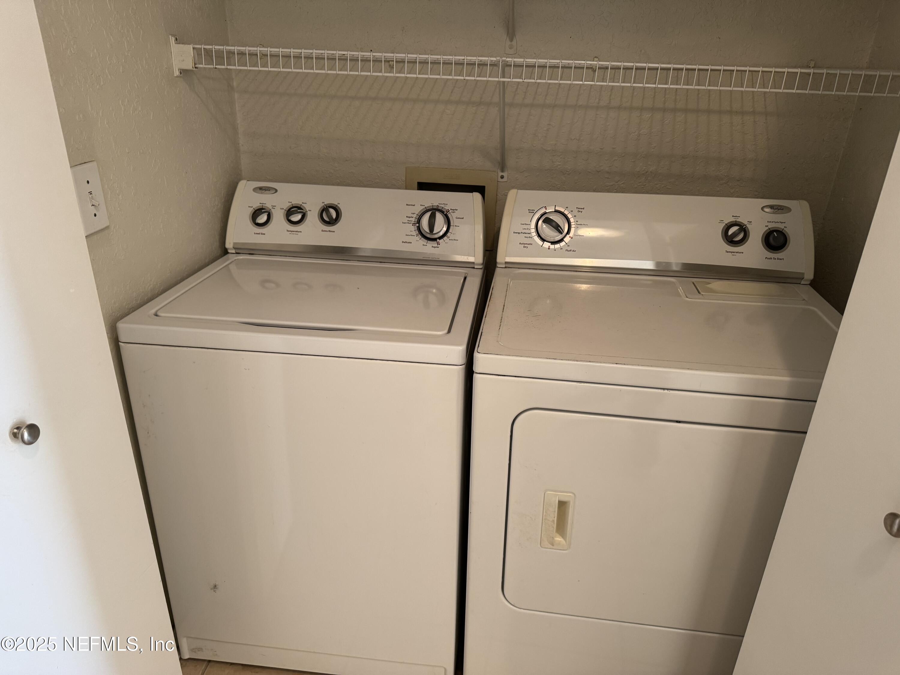1701 The Greens Way, Unit 214 Jacksonville Beach, FL 32250 - Photo 15 of 21 a close up view of washer and dryer