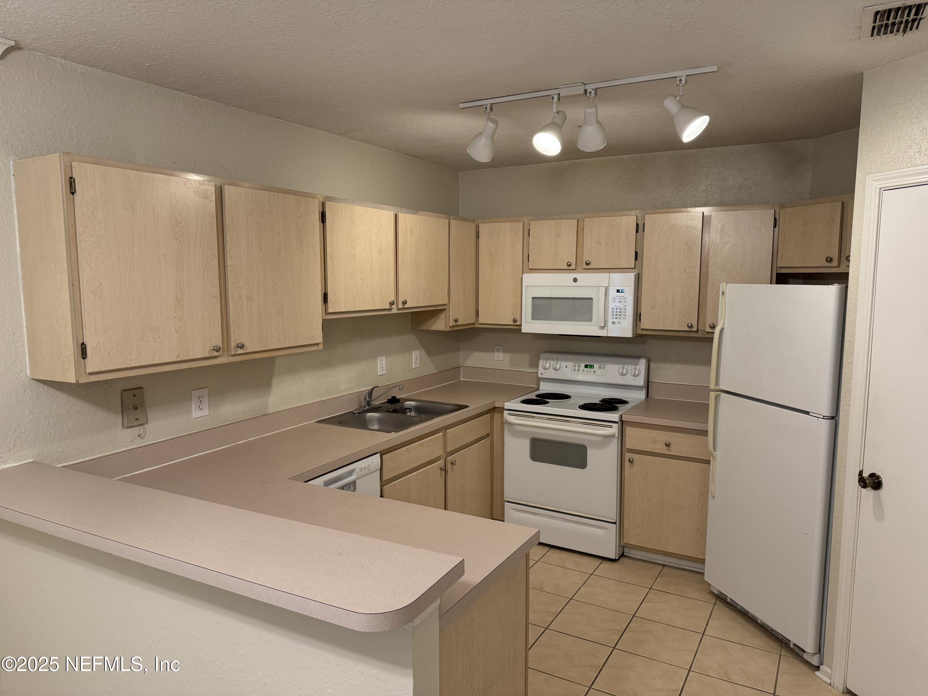 1701 The Greens Way, Unit 214 Jacksonville Beach, FL 32250 - Photo 6 of 21 IMG_8001