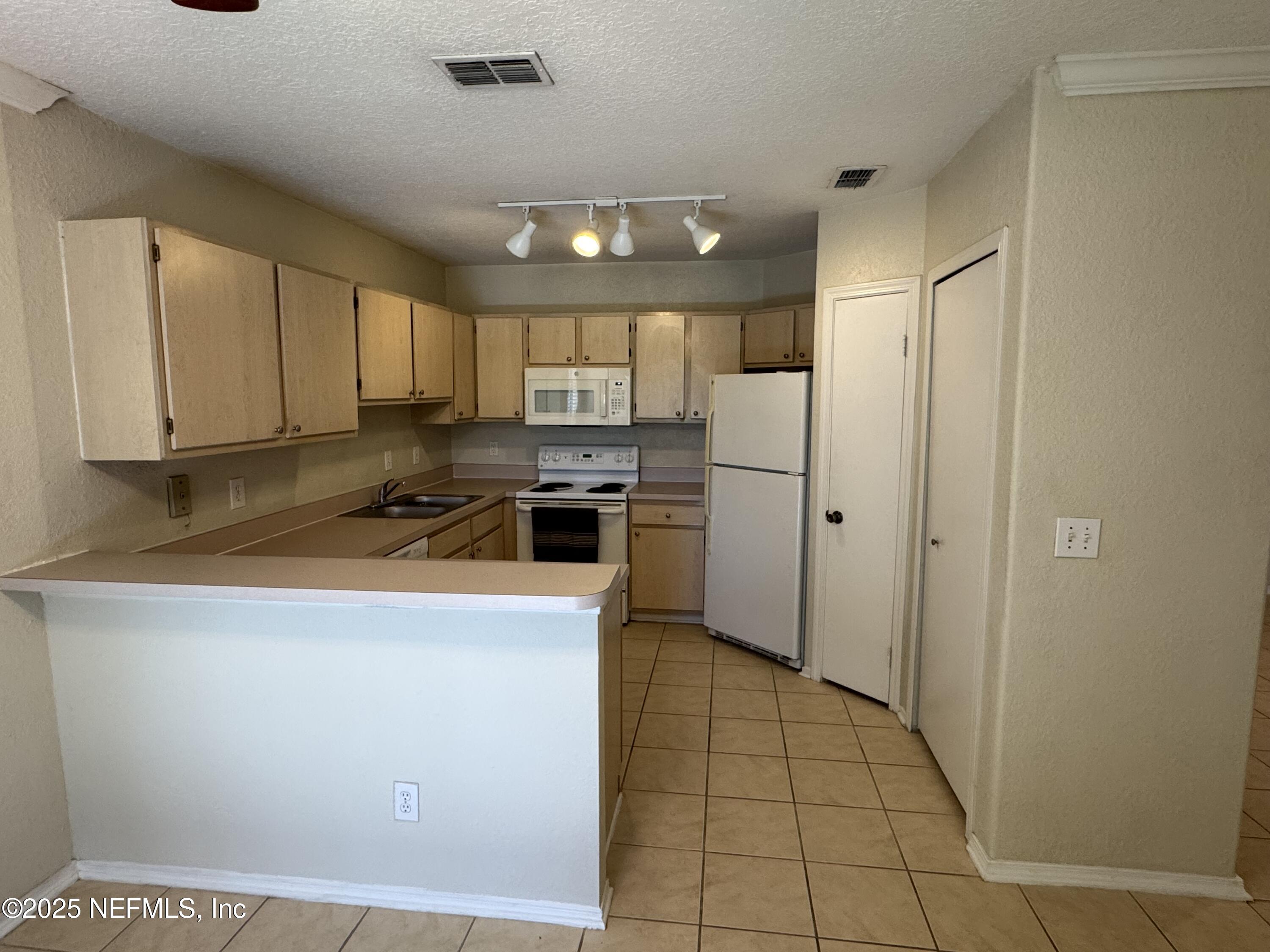 1701 The Greens Way, Unit 214 Jacksonville Beach, FL 32250 - Photo 7 of 21 IMG_8904