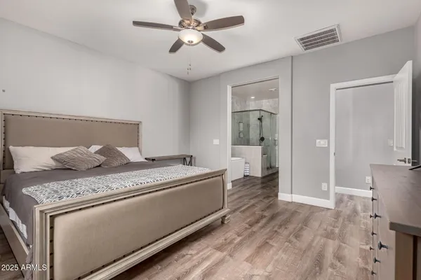 a living room with a couch and a chandelier