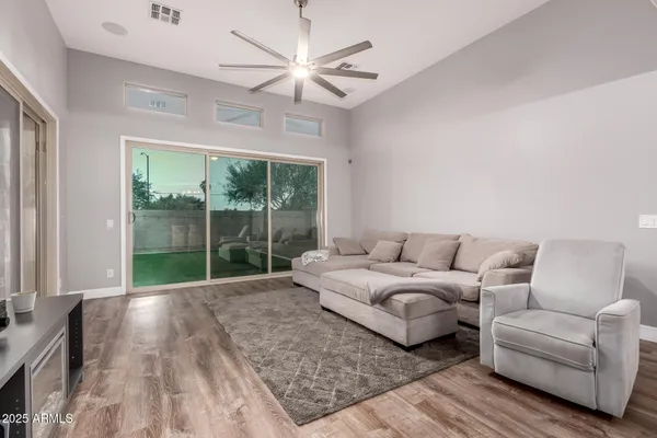 a living room with furniture and a large window