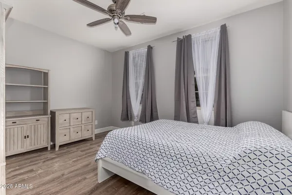 a bedroom with a bed and cabinets