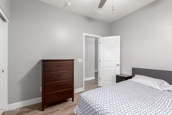 a bedroom with a bed and a dresser