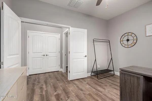 a view of a room with wooden floor