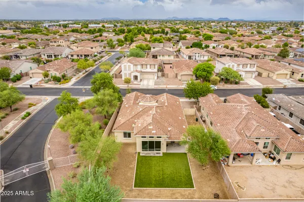 an aerial view of residential houses with outdoor space