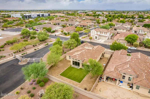 an aerial view of residential houses with outdoor space
