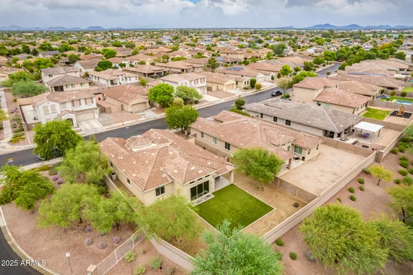an aerial view of residential houses with outdoor space