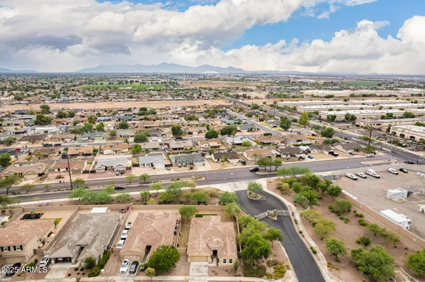 an aerial view of residential building and car parked
