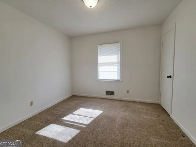 an empty room with windows