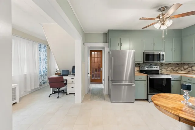 a kitchen with a refrigerator and a sink