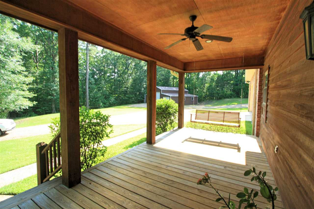 6810 Oakley Palestine Road Raymond, MS 39154 - Photo 2 of 43 Left end of porch with swing