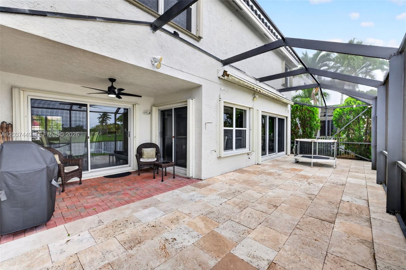 17488 Southwest 28th Court Miramar, FL 33029 - Photo 38 of 50 a view of a patio with a table and chairs