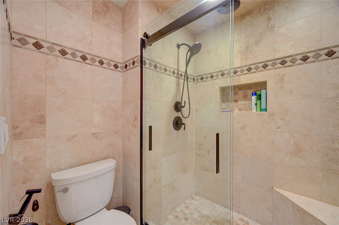 230 East Flamingo Road, Unit 106 Las Vegas, NV 89169 - Photo 15 of 66 A well-appointed shower space, complete with elegant tiling and modern fixtures.