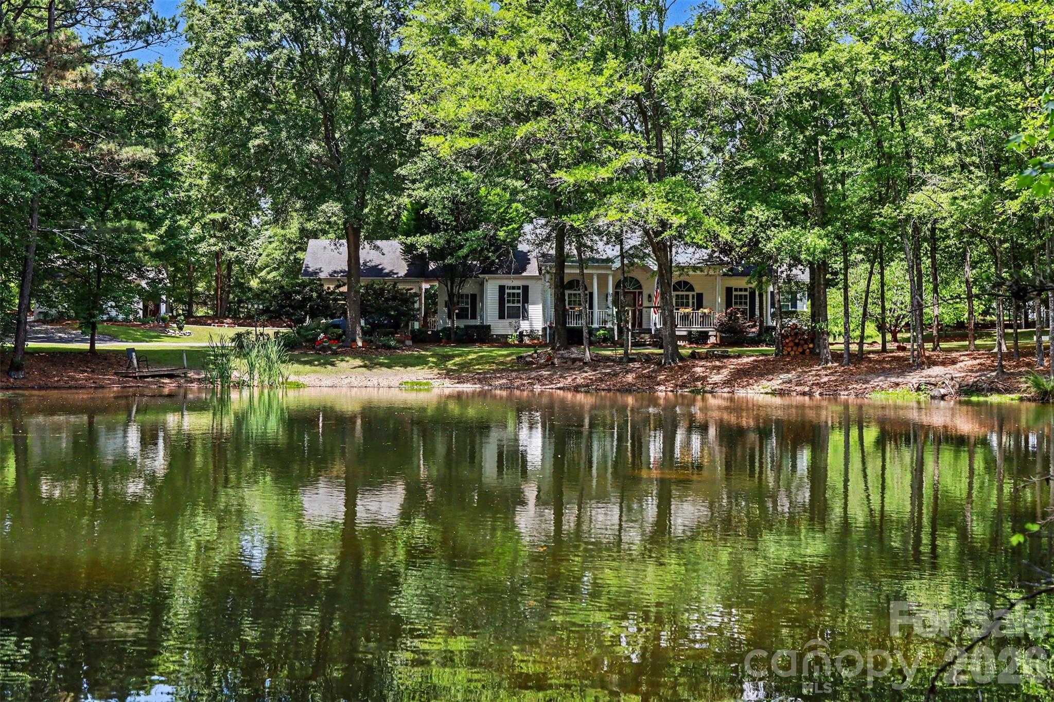 4037 Old Williamston Road Belton, SC 29627 - Photo 1 of 41 a lake view with large trees