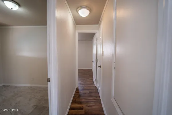 a bathroom with a sink mirror and shower