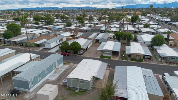 an aerial view of residential houses with outdoor space