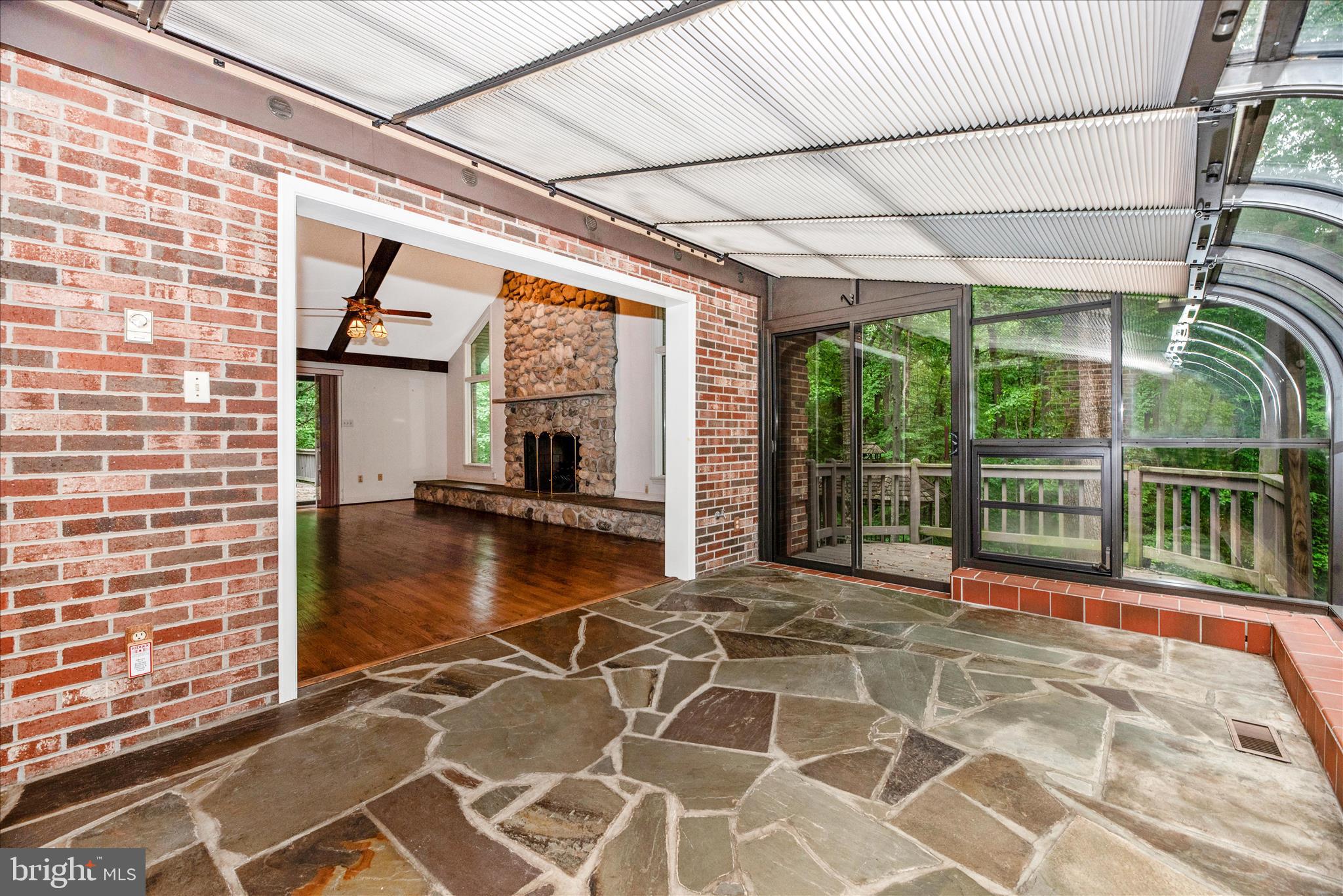 2221 Gold Mine Road Brookeville, MD 20833 - Photo 24 of 60 a view of a porch with a floor to ceiling windows
