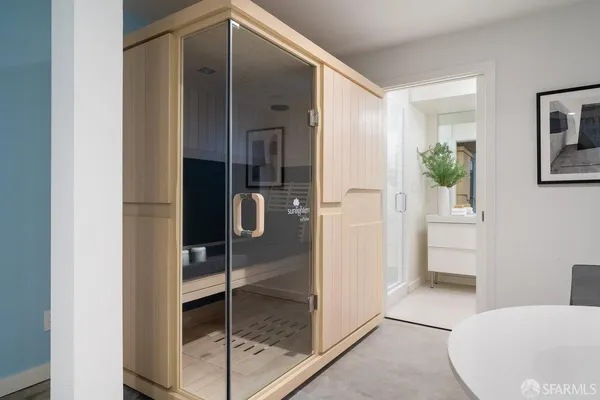 a bathroom with a shower and a sink