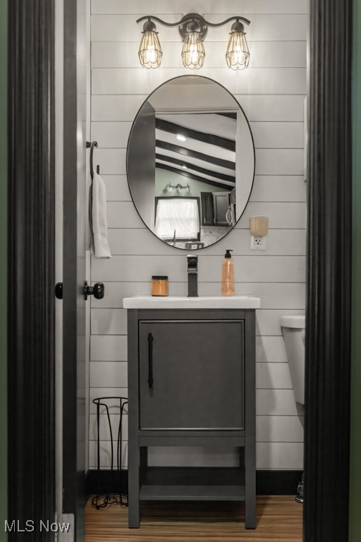 4551 17th Street Northwest Canton, OH 44708 - Photo 22 of 39 Half bathroom with vaulted ceiling and vanity