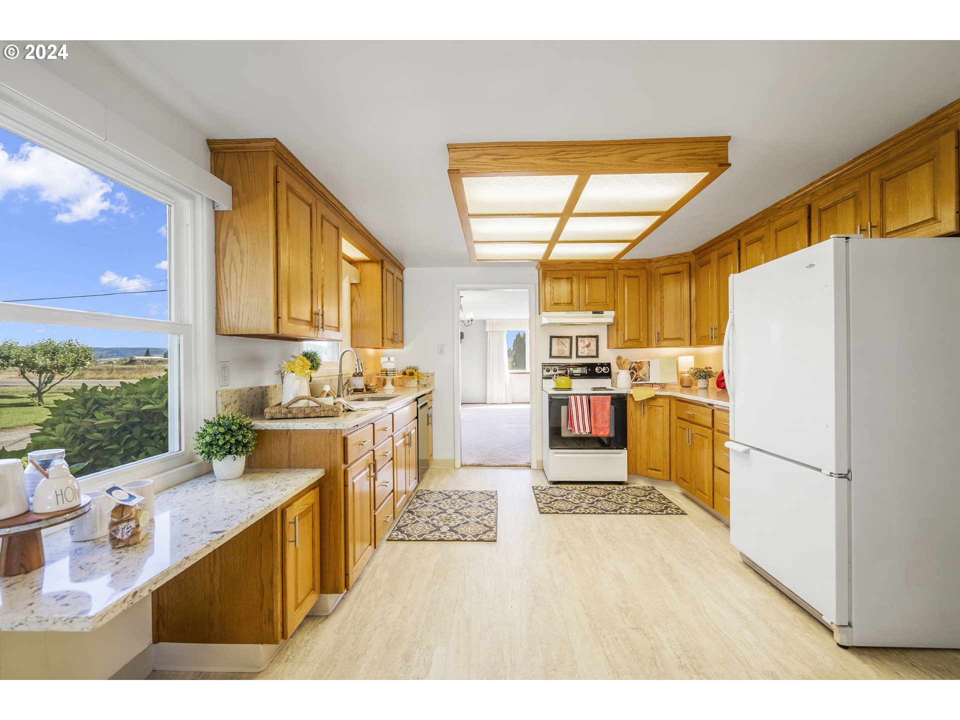7075 Northwest Roy Road Cornelius, OR 97113 - Photo 14 of 48 a kitchen with stainless steel appliances granite countertop a sink stove and refrigerator