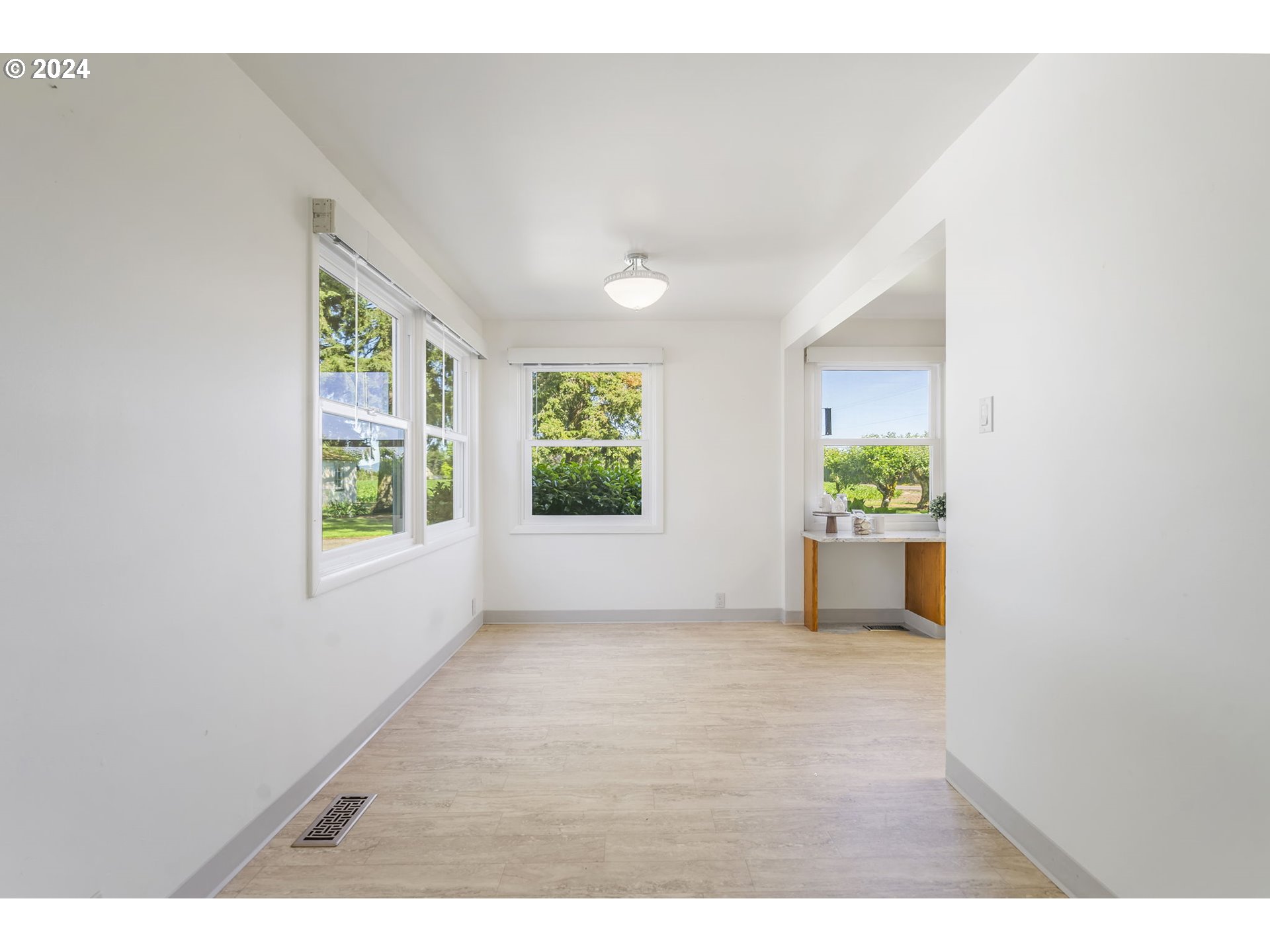 7075 Northwest Roy Road Cornelius, OR 97113 - Photo 15 of 48 an empty room with windows and yard