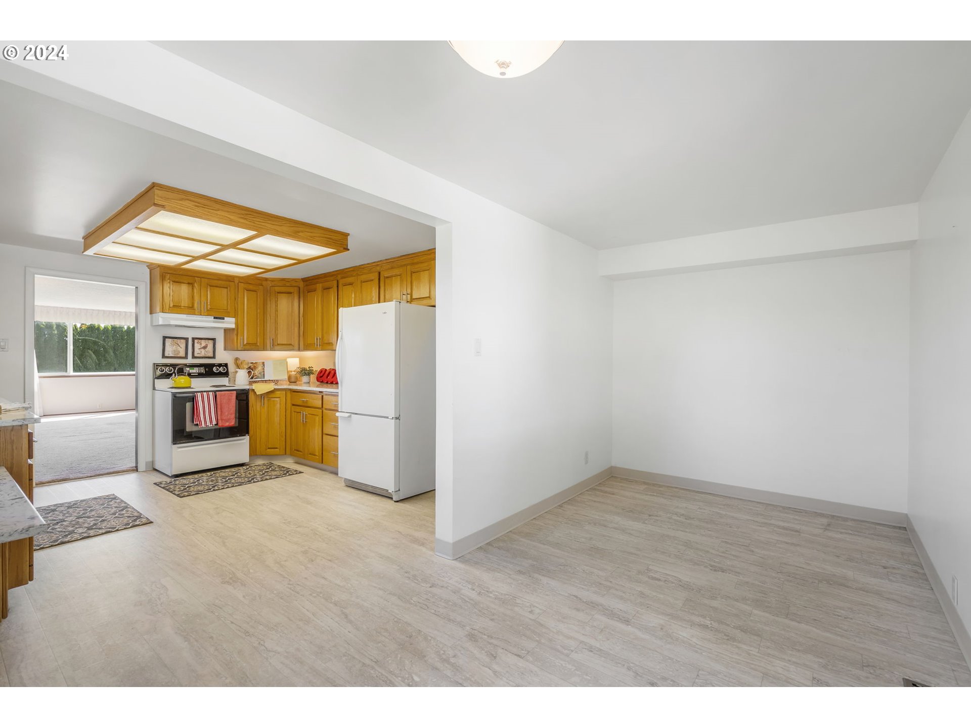 7075 Northwest Roy Road Cornelius, OR 97113 - Photo 16 of 48 a view of a kitchen with wooden floor