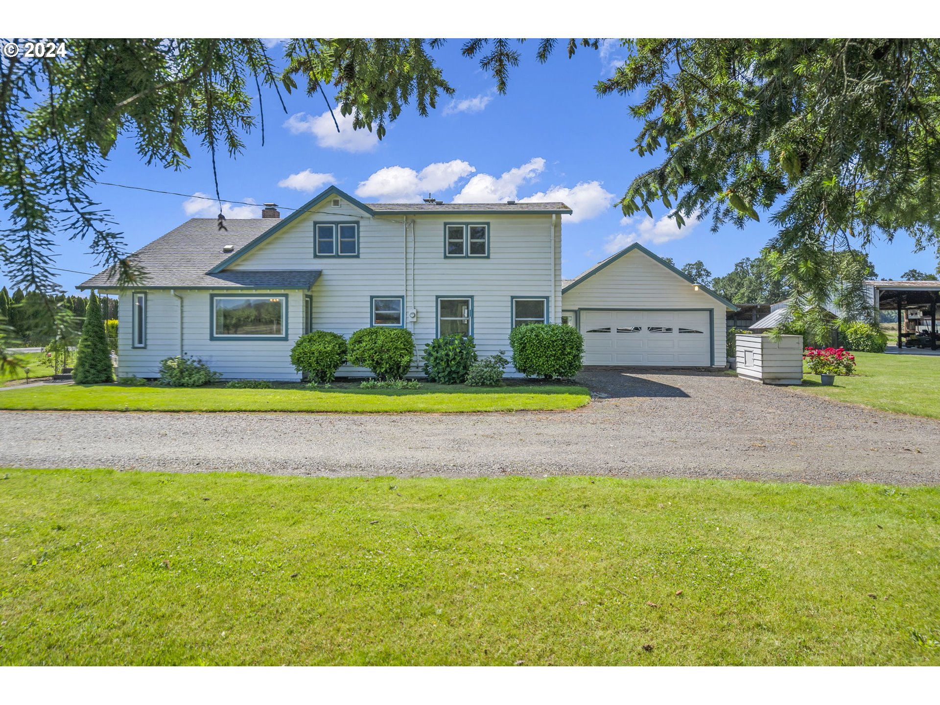 7075 Northwest Roy Road Cornelius, OR 97113 - Photo 2 of 48 a view of a house with a swimming pool