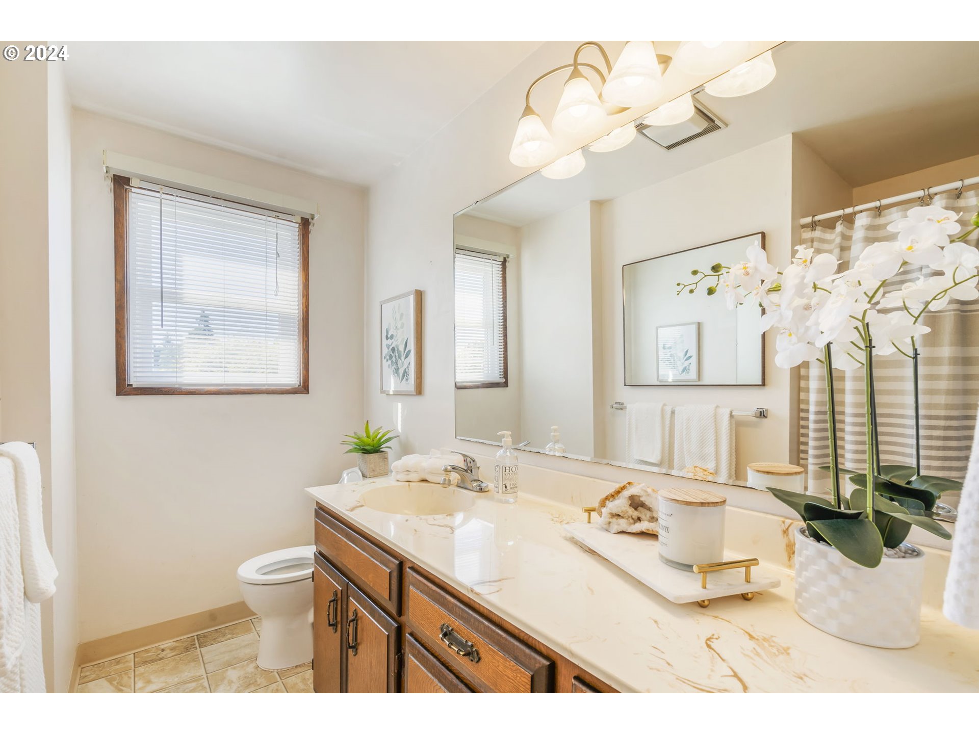 7075 Northwest Roy Road Cornelius, OR 97113 - Photo 21 of 48 a bathroom with a sink vanity granite and a mirror