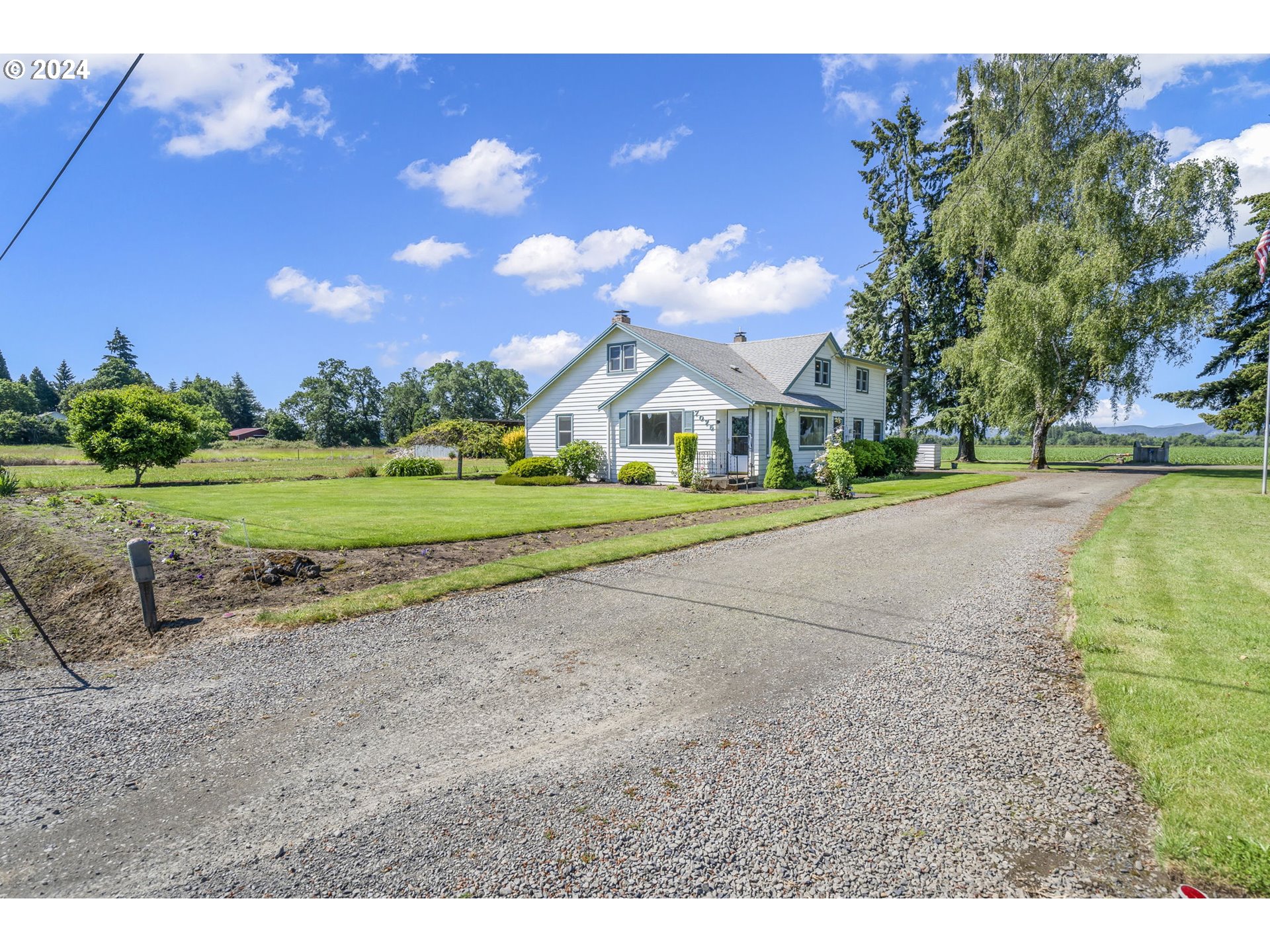 7075 Northwest Roy Road Cornelius, OR 97113 - Photo 35 of 48 a view of a house with a yard and a garage