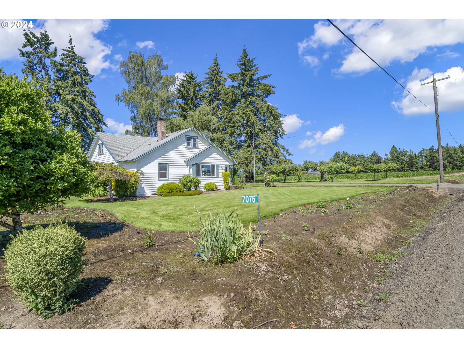 7075 Northwest Roy Road Cornelius, OR 97113 - Photo 36 of 48 a view of a house with a yard